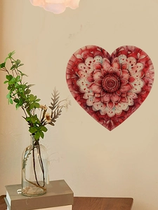 Detail of watercolor heart wall sticker with red floral pattern on home background