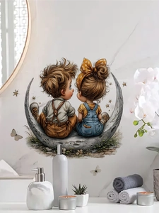 Detail of cartoon boy and girl on a crescent moon wall sticker in a modern bathroom