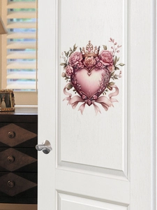 Close-up of heart crown wall sticker with pink roses on a white bedroom door surface