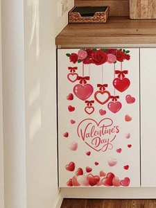 Detailed view of red rose and heart PVC wall stickers applied on white home furniture