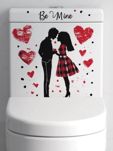 Detail of Be Mine couple silhouette sticker with red plaid dress and hearts on white surface