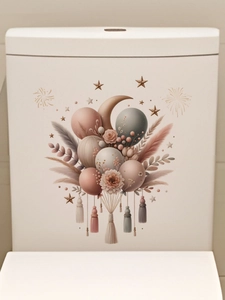 Close-up of bohemian flower and balloon decals on a white ceramic toilet tank surface