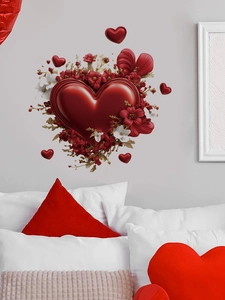 Detail of 3D red heart wall stickers with white floral accents on light grey bedroom wall