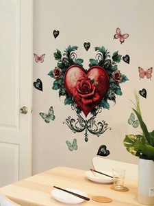 Detail of red heart wall sticker with rose and green leaves in a dining room setting