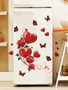 Detail view of red roses and 3D heart wall stickers on a white refrigerator surface