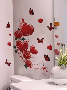Detailed wall stickers featuring red roses, hearts and butterflies in a bathroom setting