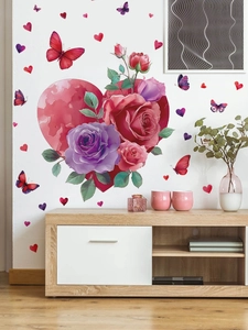 Detail view of heart and rose wall stickers with butterflies on a white living room wall