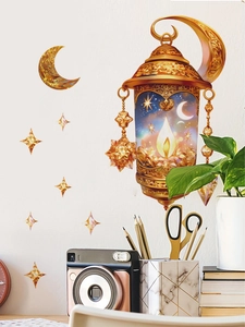 Detail view of golden exotic lantern and crescent moon wall decals on a white wall