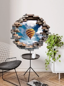 Détail d'un sticker mural 3D effet mur brisé avec montgolfière et ciel bleu