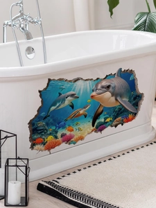 Detail showing 3D dolphin and sea turtle waterproof wall decal applied to a white bathtub