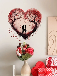 Dettaglio adesivo da parete a cuore con silhouette di coppia e foglie rosse artistiche