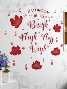 Detail of red flower bathroom rules wall sticker with instructions on marble surface