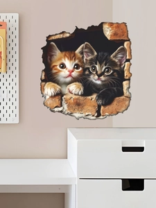 Detail of 3D cracked wall sticker showing two cute kittens peeking through red bricks