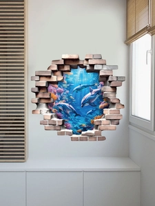 Detail of 3D broken wall sea sticker with vibrant dolphins and colorful coral reef