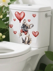 Detail of a watercolor puppy decal with a red heart balloon on a white ceramic surface