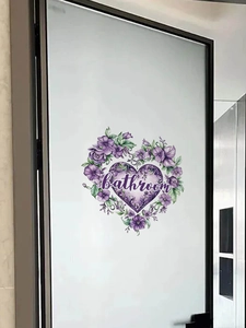 Detail of a purple watercolor floral heart wall sticker with bathroom text on frosted glass
