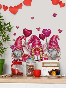 Detail of pink Valentine's Gnomes wall stickers with heart motifs on a gray wall