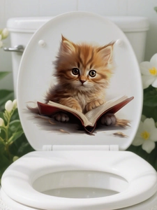 Detail of 3D waterproof PVC cat sticker showing a cute ginger kitten reading on a toilet lid