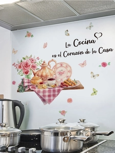Detail of floral kitchen wall decal with tea set and Spanish quote on white tile background