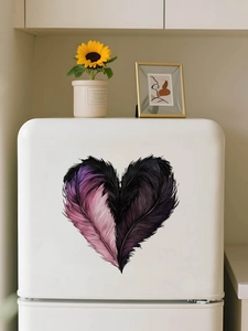 Detail of heart-shaped feather wall decal applied on a modern white mini fridge