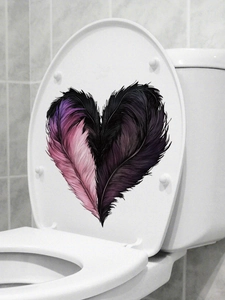Detailed heart-shaped feather decal applied to a white toilet lid in a modern bathroom
