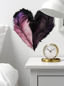 Detail of heart feather wall sticker with purple gradient on a white bedroom wall
