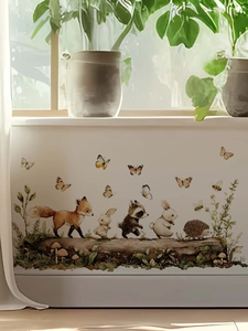 Detail of forest animal wall stickers with fox, rabbit and raccoon on wood logs