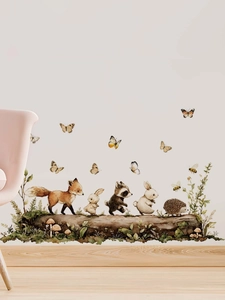 Detail showing forest animal wall decals with watercolor fox, rabbit and raccoon designs