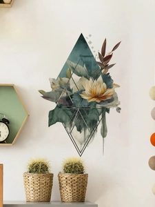Détail du sticker mural floral losange avec lys et feuilles vertes sur fond blanc