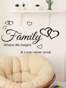 Detail of minimalist Family wall sticker with artistic letters and heart icons on white wall