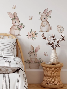 Detalle de vinilos de pared de conejitos rosas en acuarela con flores para dormitorios