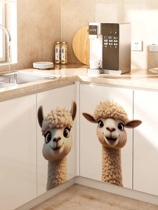 Close-up of cute cartoon alpaca wall stickers on modern white kitchen cabinets