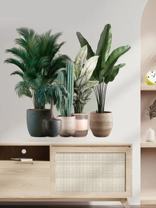 Detail of tropical plant wall stickers featuring palm leaves and potted greenery decor