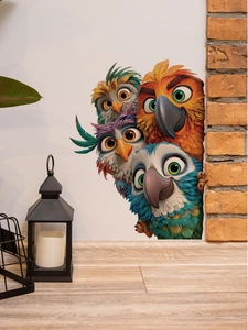 Detail showing 3D cartoon birds wall stickers peeking from behind a white wall edge