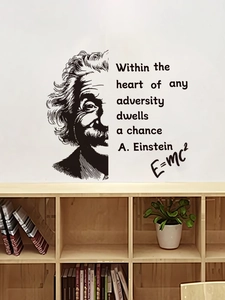 Detail of Albert Einstein wall decal featuring famous quote and E=mc2 on white wall