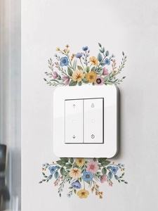 Detail of smart white light switch with floral wall stickers and functional icons