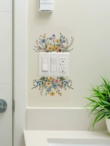 Detail of colorful wildflower wall decals surrounding a triple light switch panel