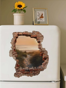 Close-up of 3D cracked wall sea view sticker on a white vintage refrigerator door