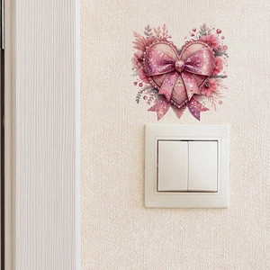 Pink heart switch sticker featuring a large glittery bow and floral accents for wall decor