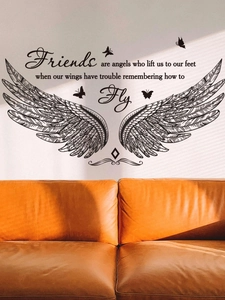 Detail of wing wall decals with motivational quote and butterflies above a sofa