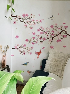 Detailed wall sticker showing cherry blossom branches and colorful birds on a white wall