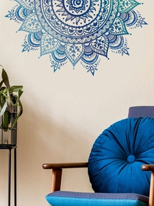 Detailed view of bohemian blue mandala wall sticker on a beige living room wall decor