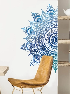 Detail of blue gradient mandala wall sticker with intricate patterns in a modern living room