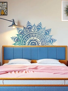 Detailed blue mandala wall sticker placed above bed for modern bedroom decor