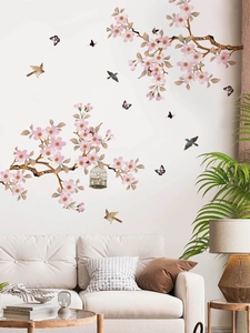 Pink cherry blossom branch wall decals with birds and vintage birdcage for living room decor