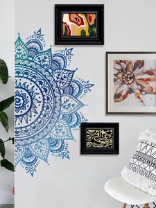 Macro detail of a navy blue gradient mandala wall decal on a clean white interior wall