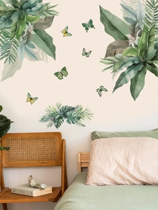 Detailed bedroom scene with tropical green palm leaves and butterfly wall stickers