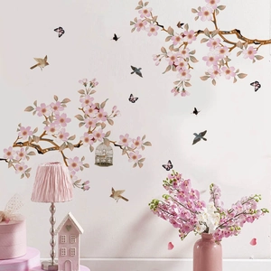 Pink cherry blossom wall sticker set with branches, birds, and birdcage for home decor