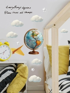Detail of vintage globe wall decals with white clouds and stars for kids' bedroom