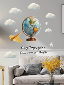 Detail of world globe wall stickers with clouds, paper plane and inspirational quote